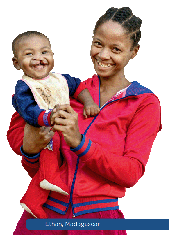 A mother holding her smiling child