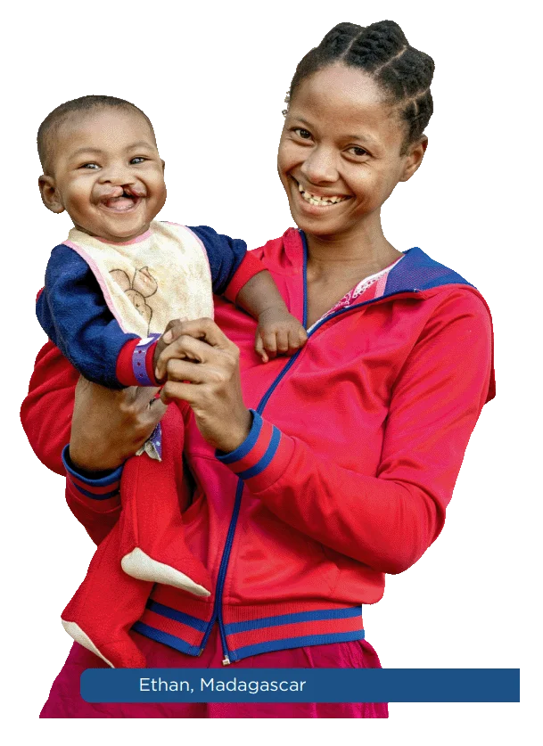 A mother holding her smiling child